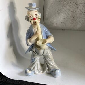 Clown making music He’s made of the blue China looking like lladro blue